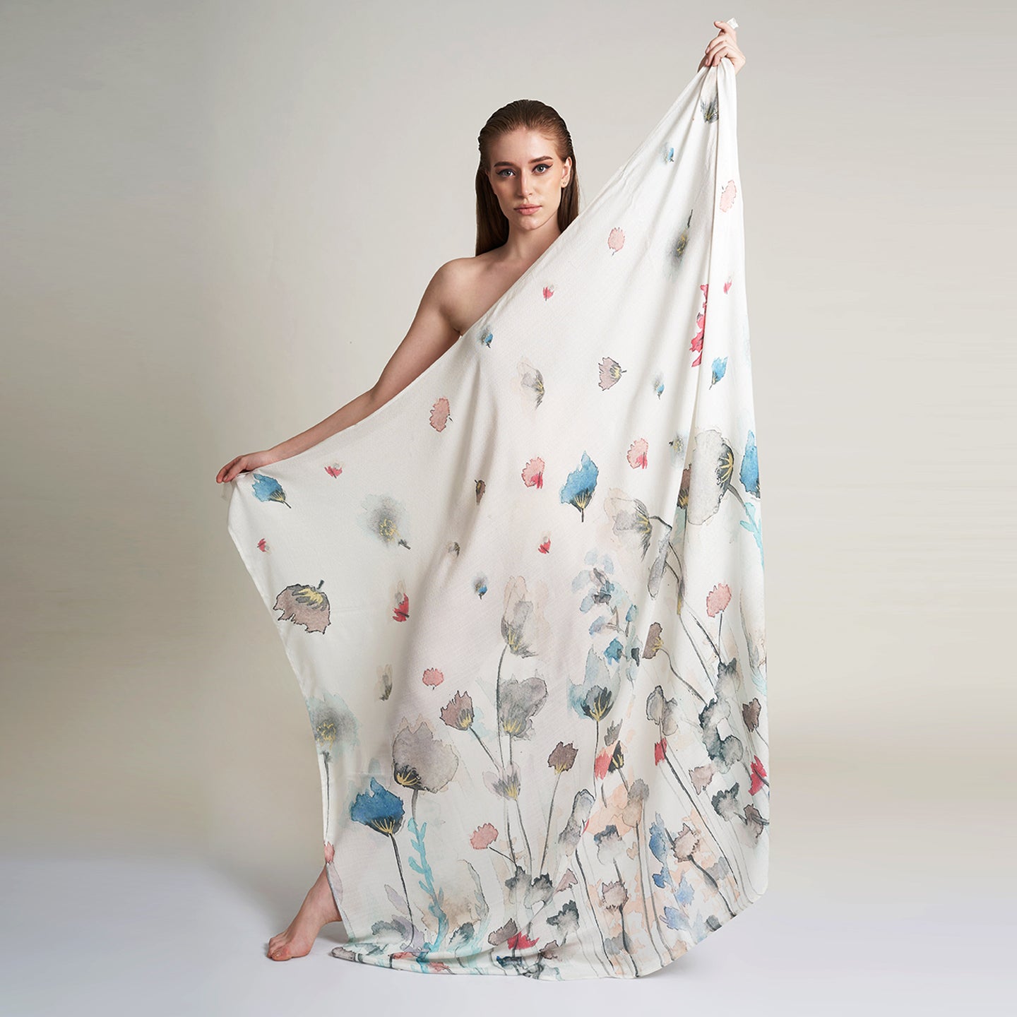 A Square organic Aloe vera fabric scarf, printed on a white base with multicolor flowers and petals flying.