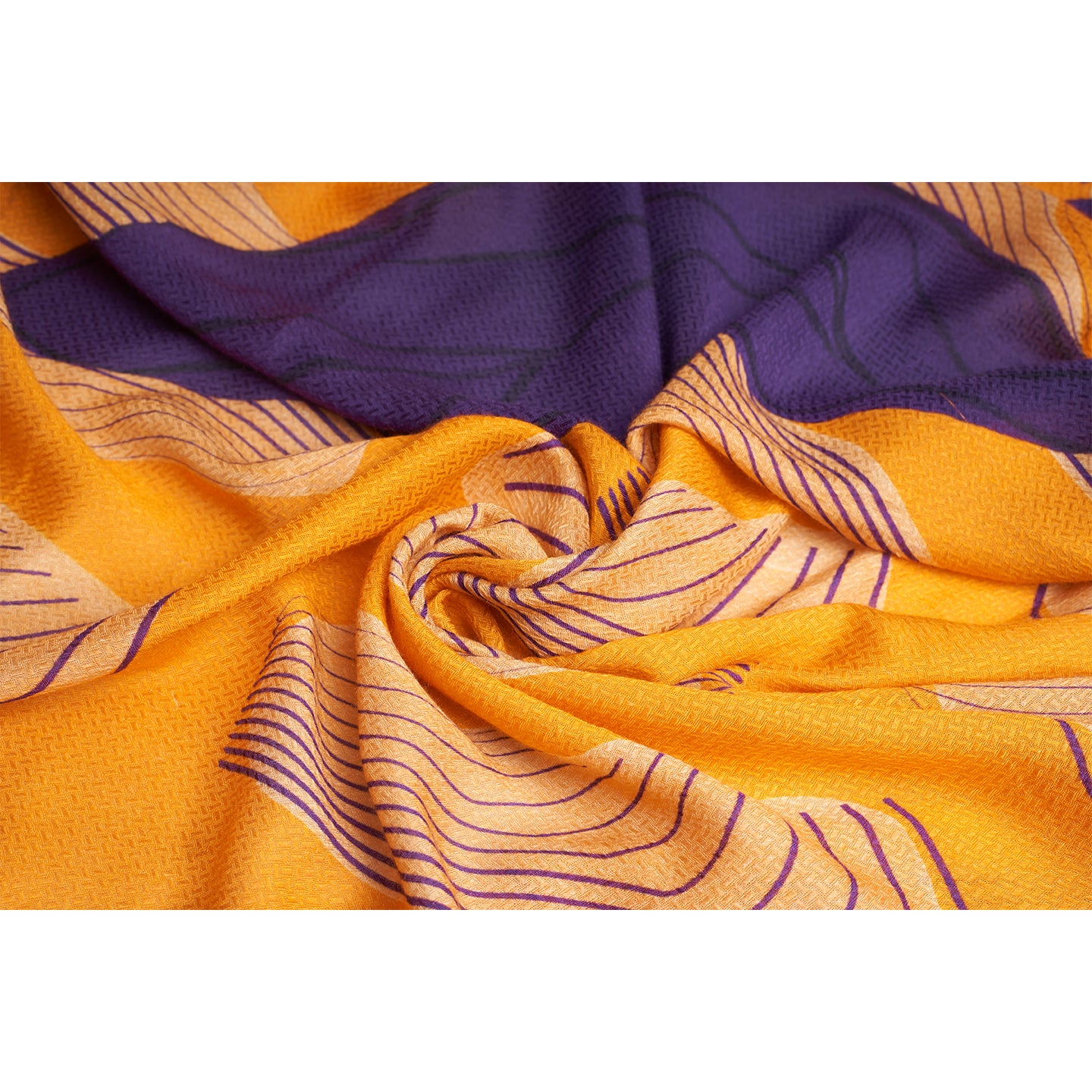 Amahle, a square scarf crafted from an organic Aloe Vera fabric, inspired by the intricate details of antique wall artworks adorned with climbing plant vines. This captivating scarf features a vibrant orange base adorned with elegant purple vine.