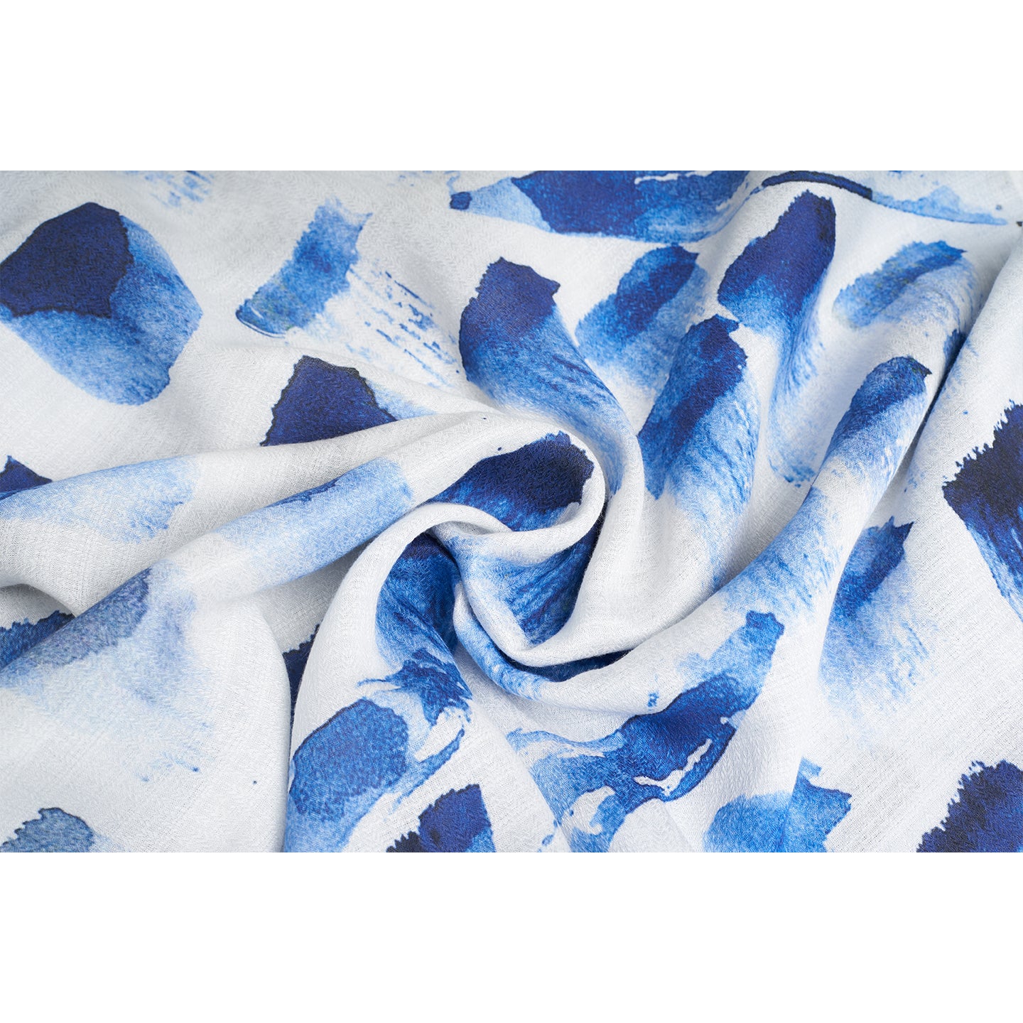 A Rectangular scarf made from organic rose petal fabric printed with non toxic GOTS certified inks. the print is inspired from paint brush strokes and leaves in blue, navy , white and black color..