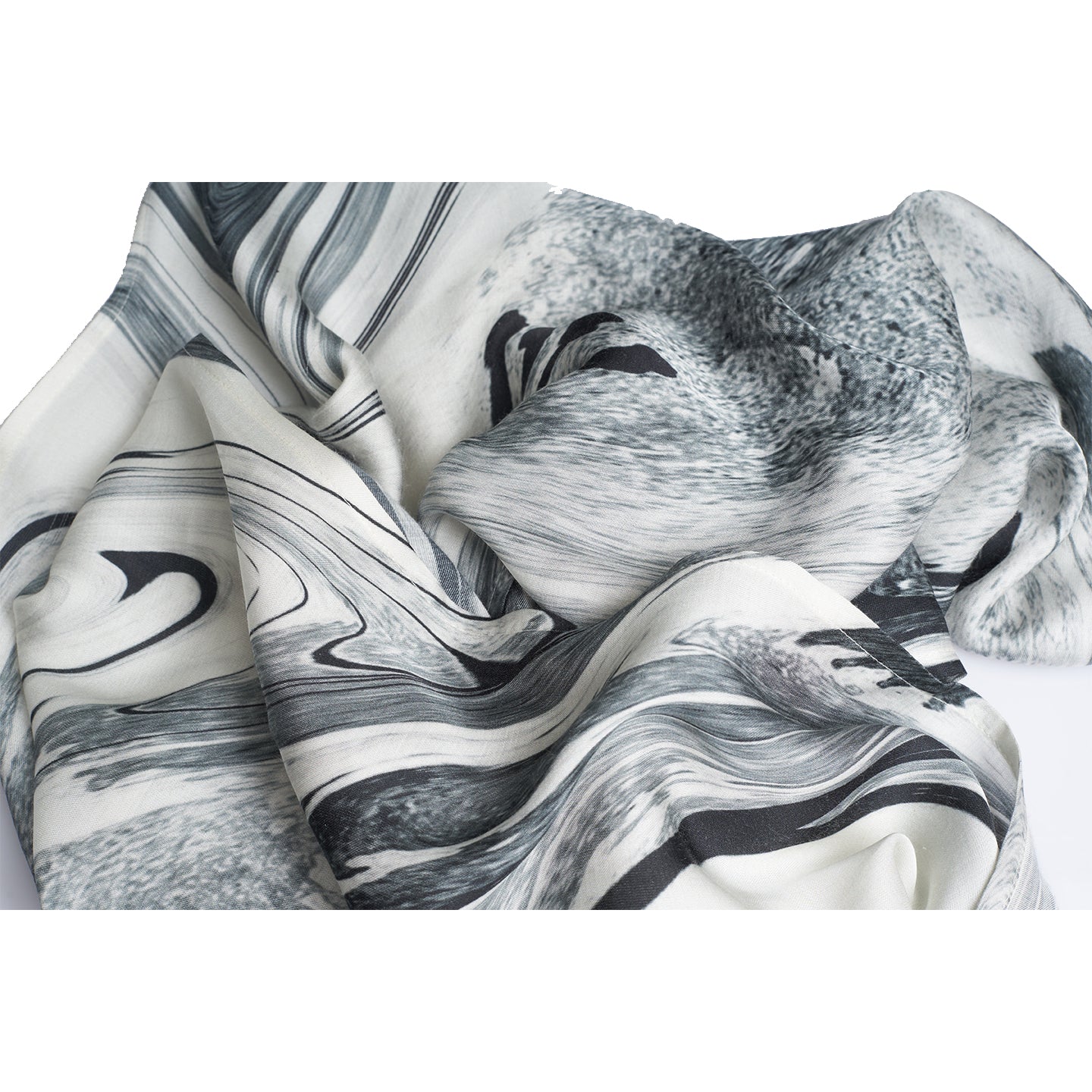 A close up photo of black and white thin printed scarf made from organic rose petal fabric, printed with non toxic GOTS certified inks. this print is inspired from antique black and white photographers of fields and paints