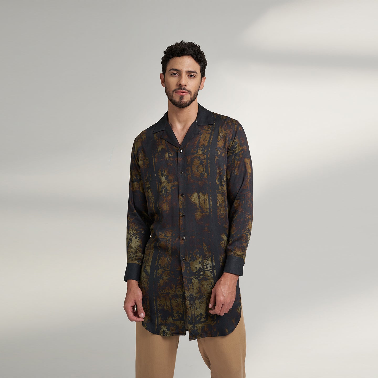 Medium size model wearing Organic Lotus fabric shirt printed with with non toxic GOTS certified inks with subtle black and beige print with cuban collars,the print is inspired from a antique forest painting. 