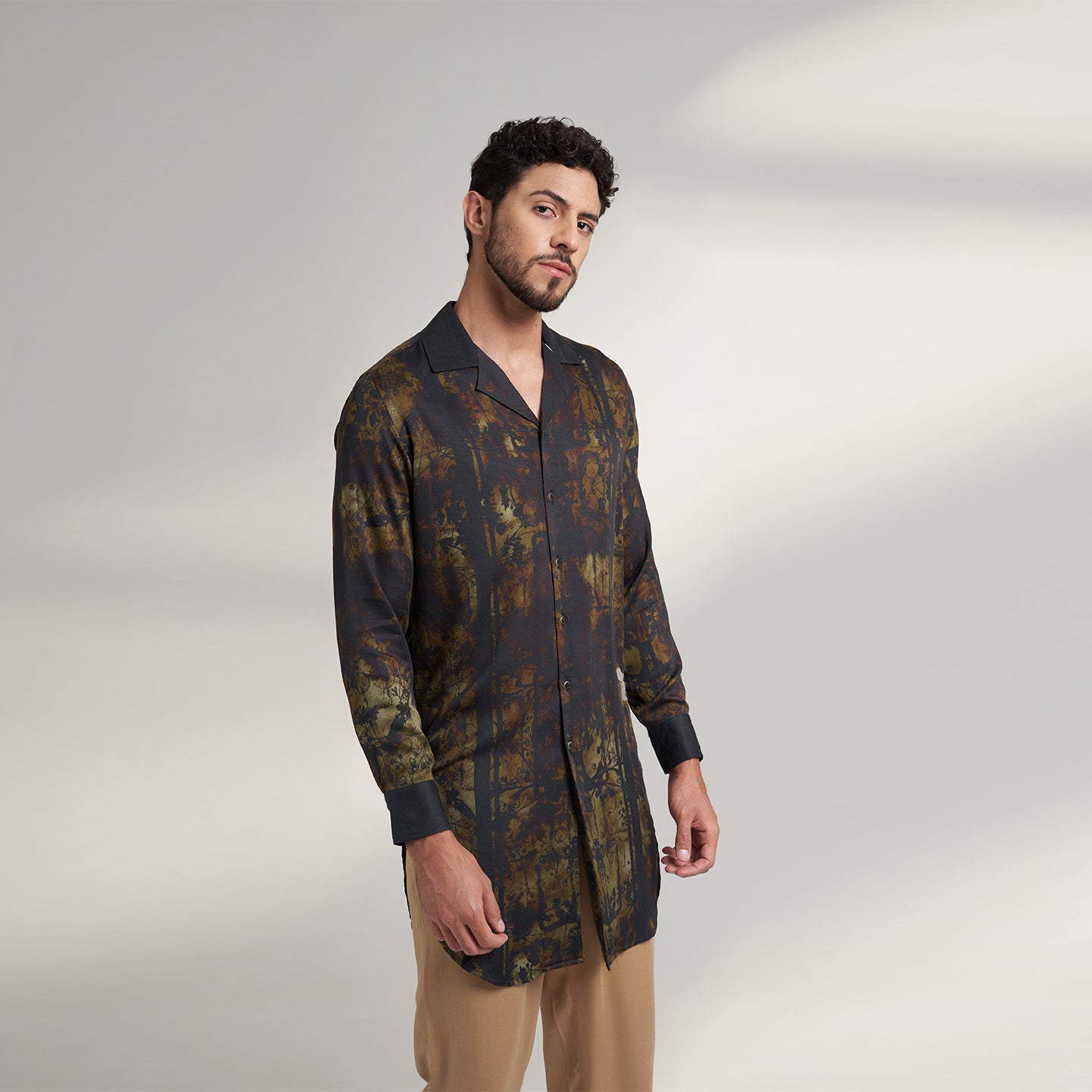 Medium size model wearing Organic Lotus fabric shirt printed with with non toxic GOTS certified inks with subtle black and beige print with cuban collars,the print is inspired from a antique forest painting.