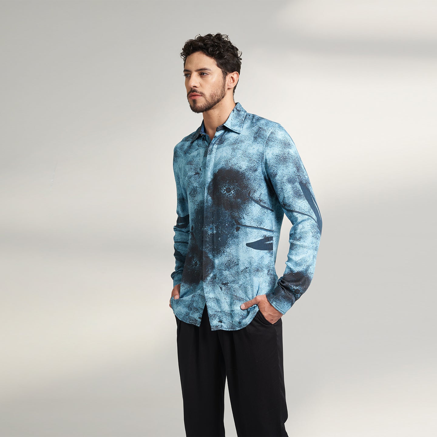 A BLUE AND BLACK PRINTED SHIRT MADE FROM ORGANIC LOTUS STEM FABRIC, PRINTED WITH NON TOXIC GOTS CERTIFIED PRINT. THIS SHIRT HAS A COMFORT FIT