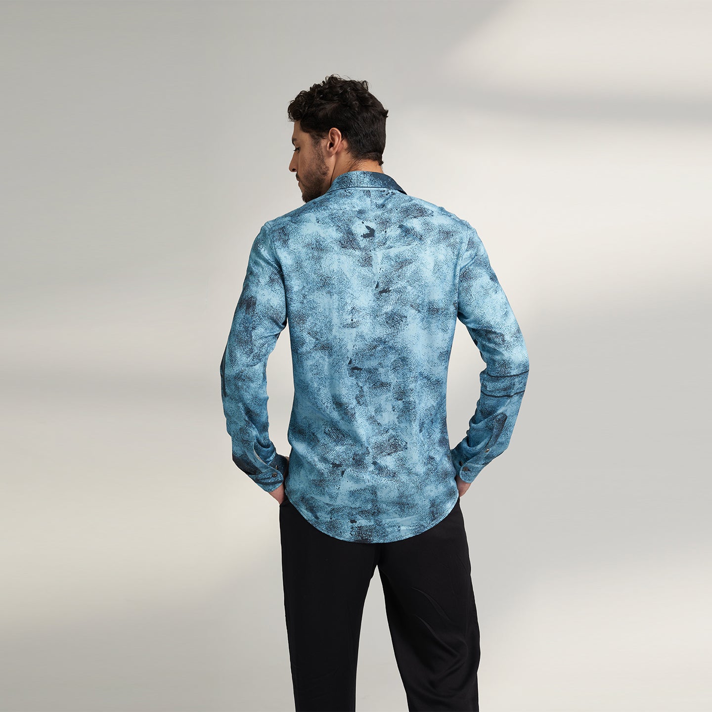 A BLUE AND BLACK PRINTED SHIRT MADE FROM ORGANIC LOTUS STEM FABRIC, PRINTED WITH NON TOXIC GOTS CERTIFIED PRINT. THIS SHIRT HAS A COMFORT FIT