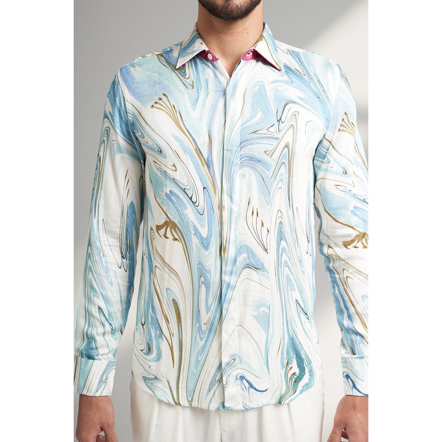 An Organic lotus stem silk fabric printed shirt in blue white and brown color, printed with non toxic GOTS certified inks. the shirt is printed by an inspiration from antiques.